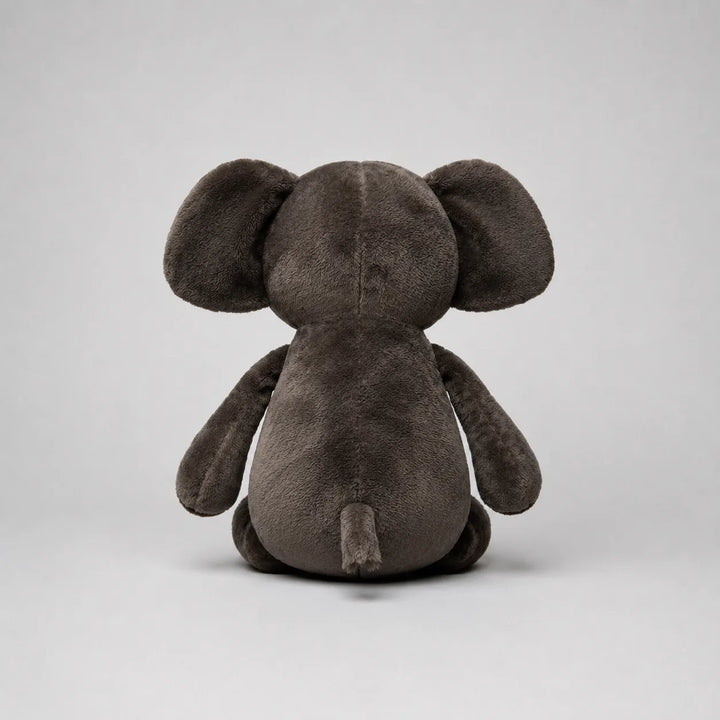 A dark brown plush elephant toy shown from the back, sitting against a neutral light gray background.