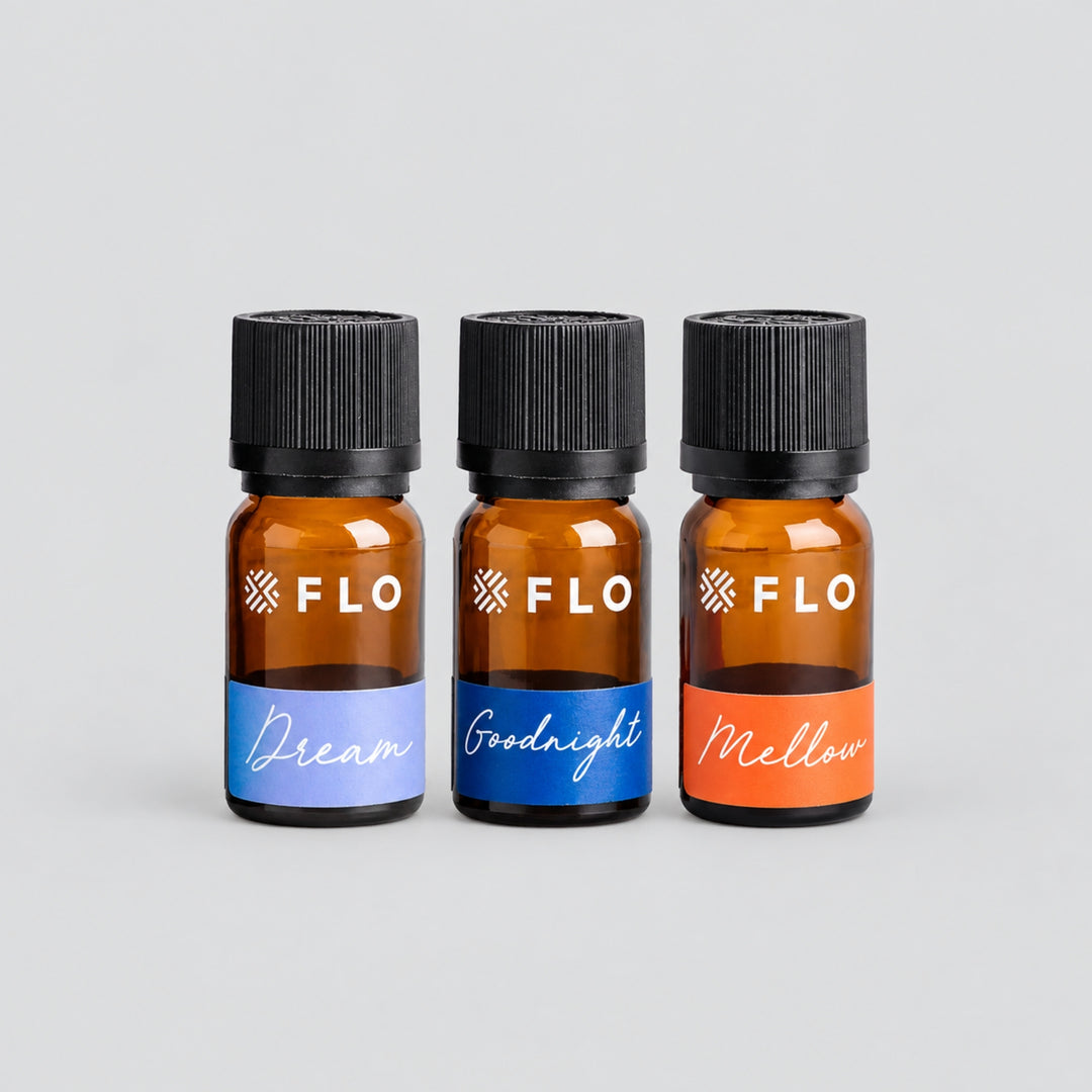 Flo Aroma essential oil trio featuring Dream, Goodnight and Mellow blends in amber glass bottles with colourful labels.