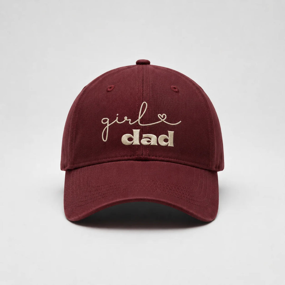 Maroon cap with 'girl dad' text on a white background