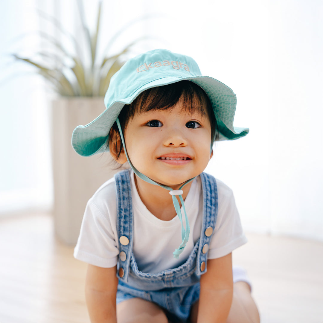 Toddler wearing green sun hat personalised
