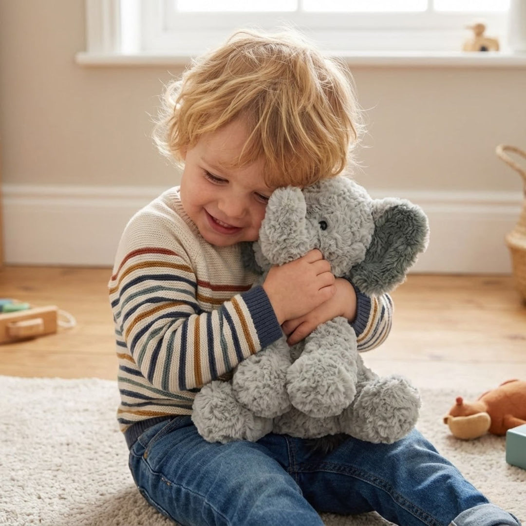 Boy hugging Gund Cozys Elephant 10 Inches