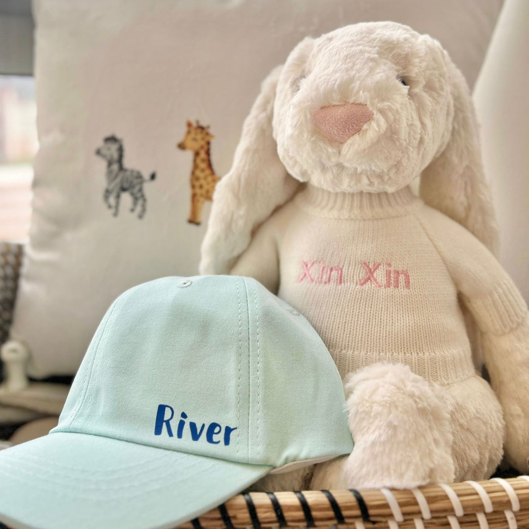 Hats By Fly Light Blue Baseball Cap personalised with "River" in Blue with Cream Jellycat Bunny