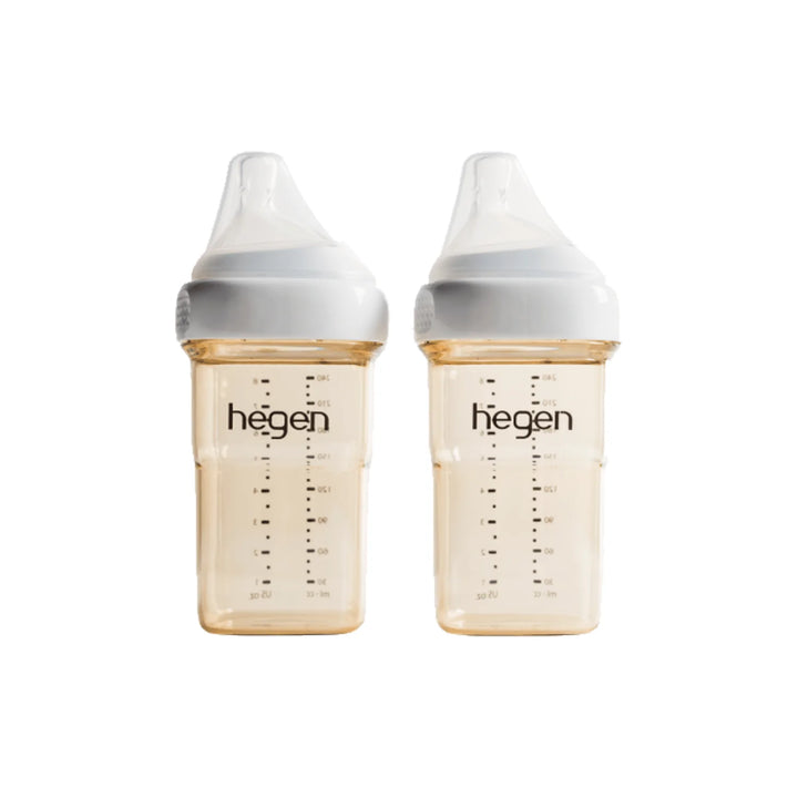 Two Hegen baby bottles on a white background