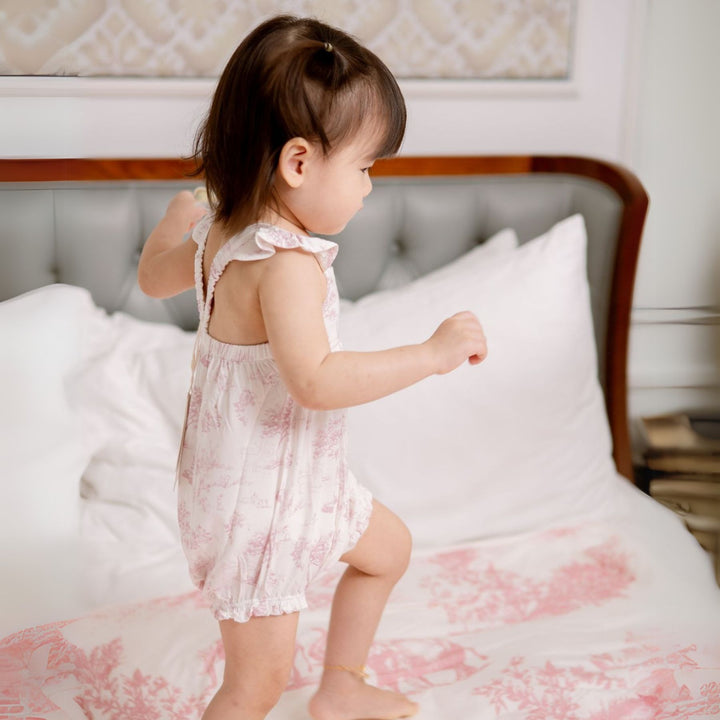 Toddler wearing House of Holly Garden Toile Ruffle Bubble Romper in Pink