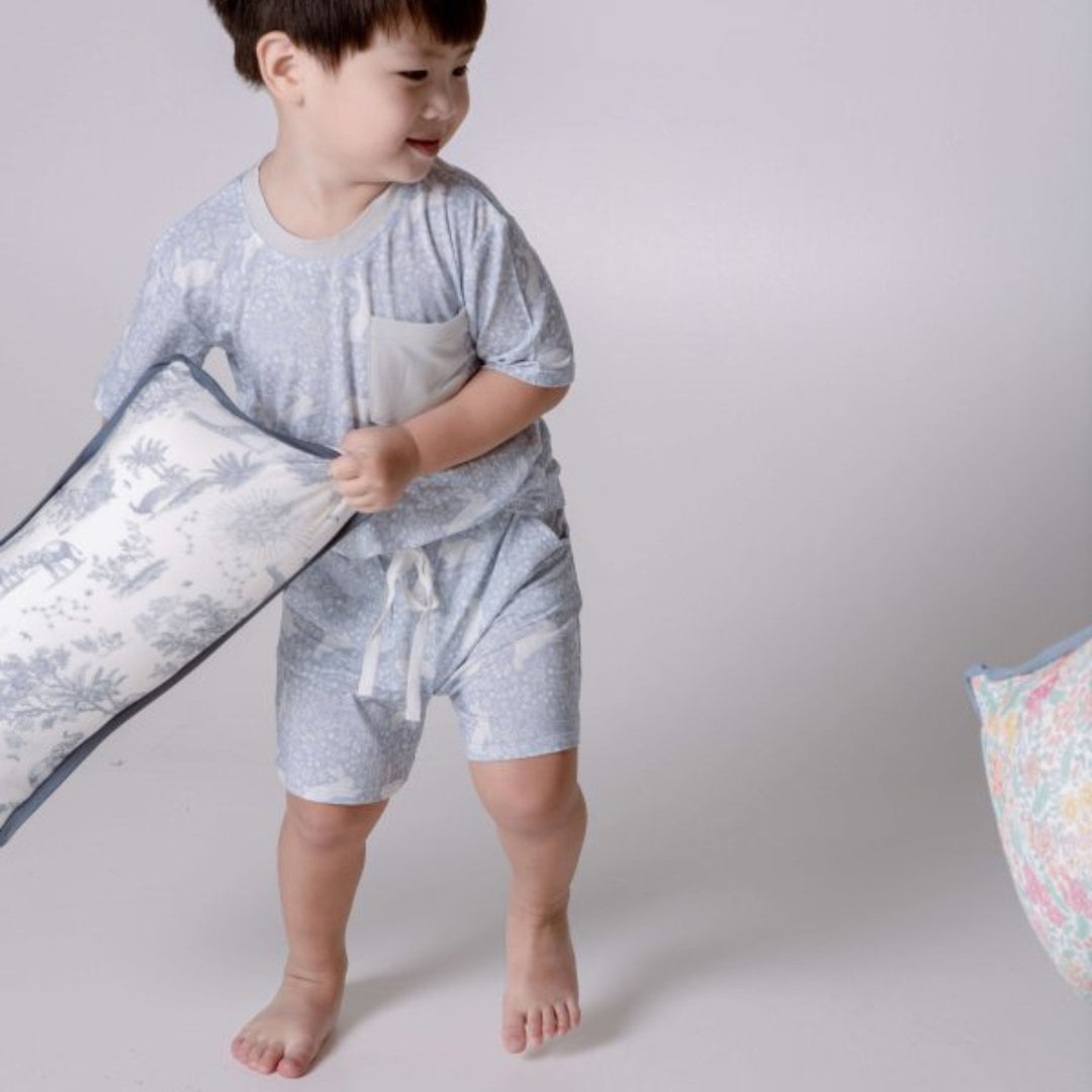 Toddler playing with House of Holly Luxe Cloud Pillow – Savanna in Midnight Blue