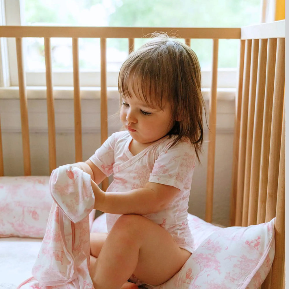 Soft bamboo baby onesie with jungle-themed illustrations