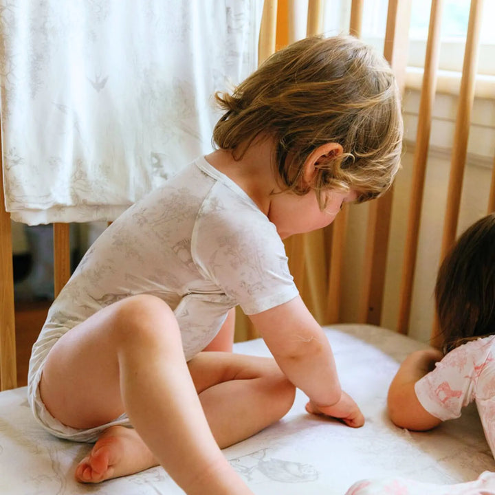 Neutral-toned Wild Toile onesie perfect for daily wear or naps