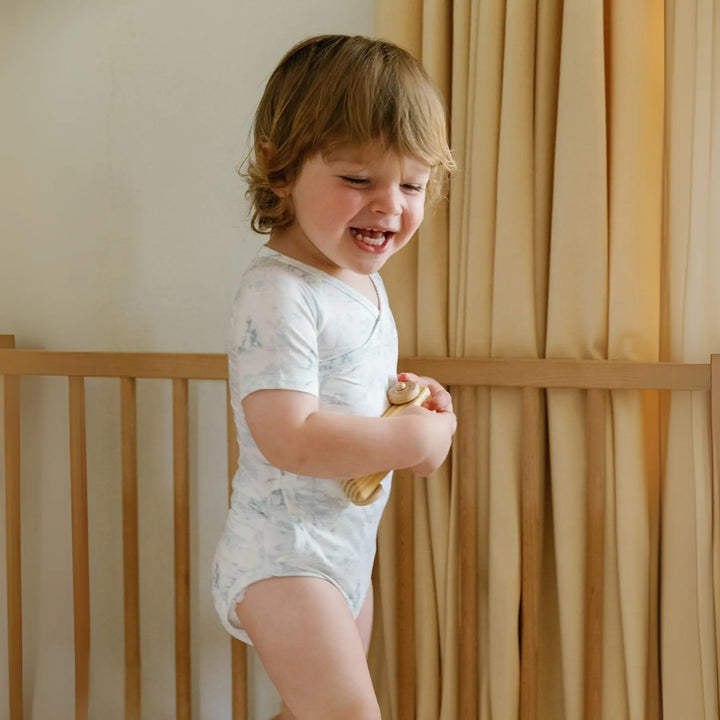 Eco-friendly bamboo baby onesie with cheetah and kangaroo pattern