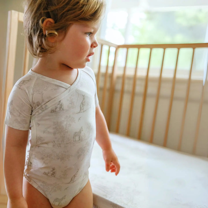 Close-up of soft tie wrap design on baby bodysuit