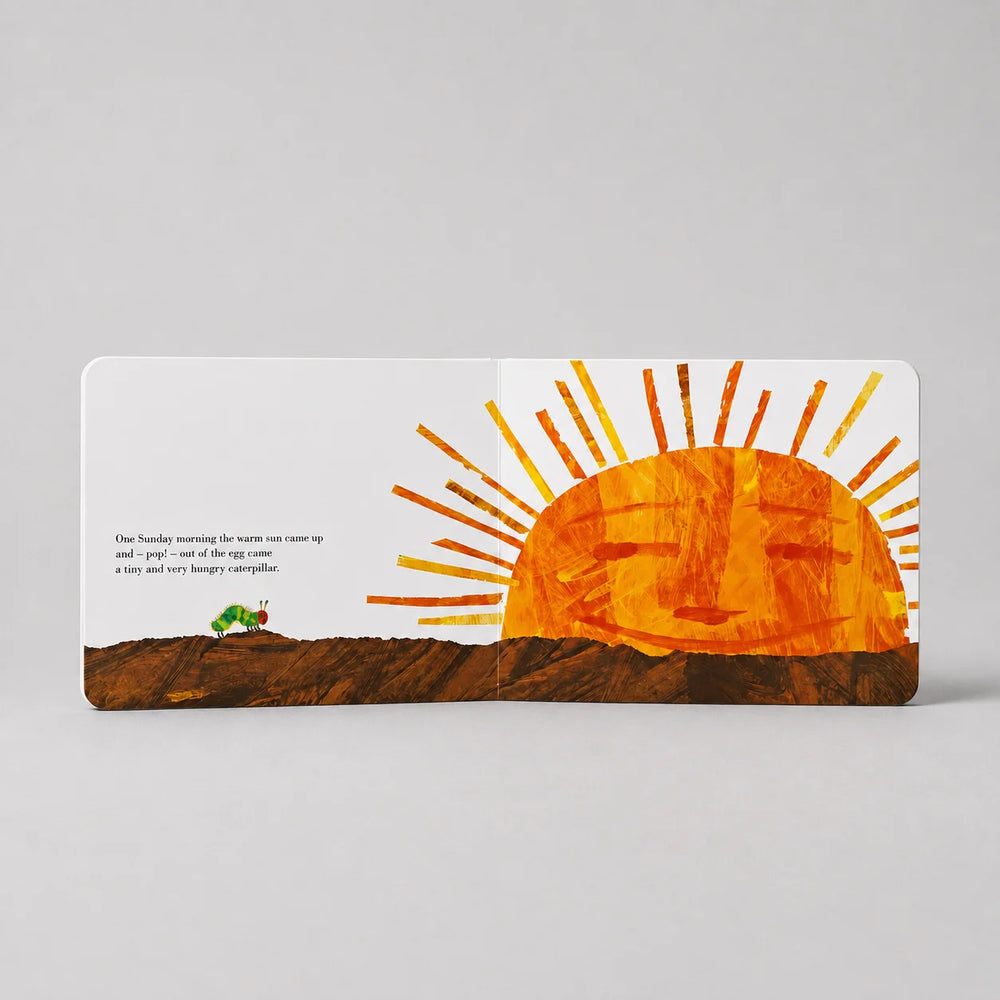 Children's book page with a sun illustration on a gray background