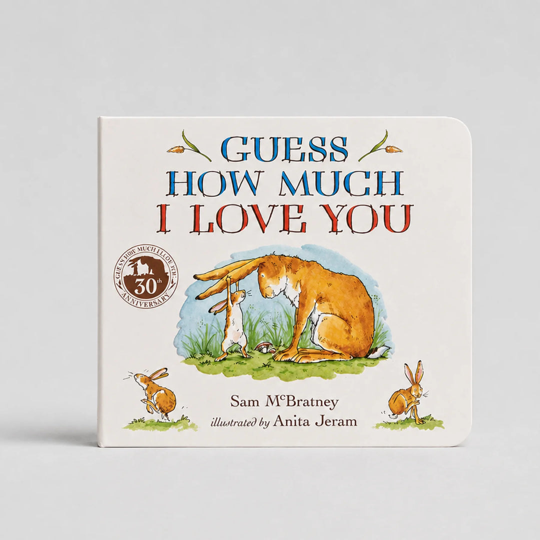 Children's book titled 'Guess How Much I Love You' with illustrations of a fox and two rabbits on a white background.