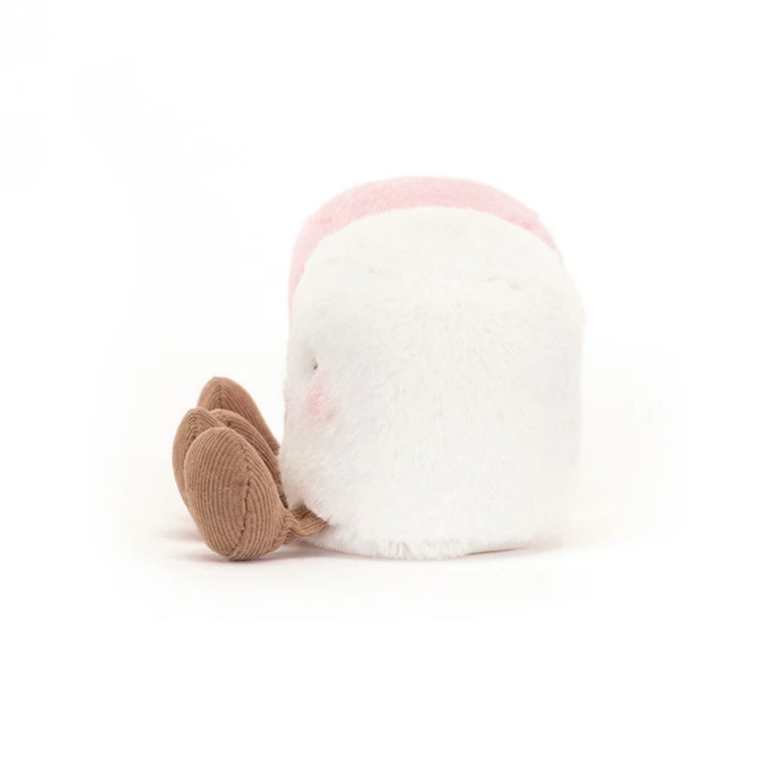 White marshmallow soft toy shown from the back, featuring fluffy plush fabric, a soft pink top and brown corduroy legs.