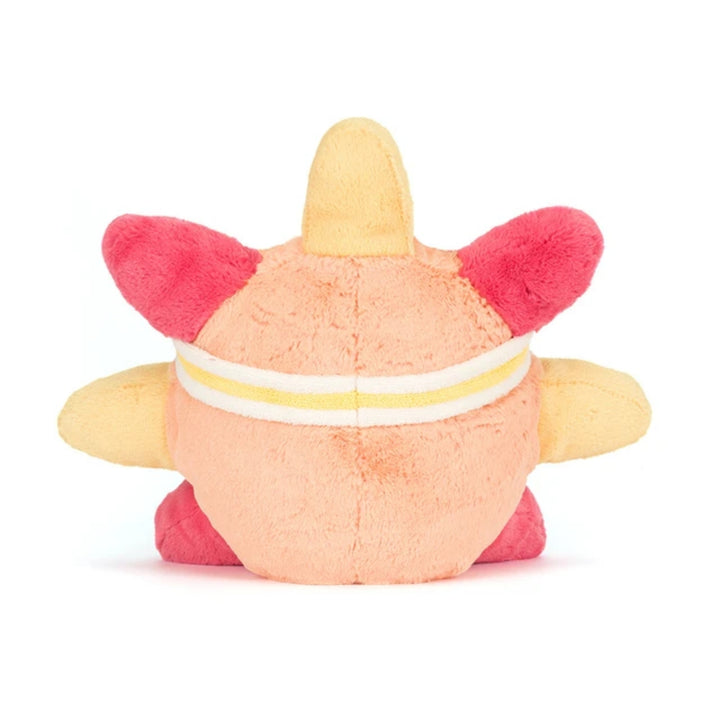 Back view of the peach and yellow roller-skating sun soft toy, showing the striped sweatband, bright pink side details and yellow arms.