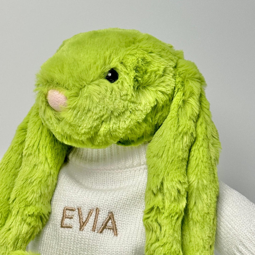 Jellycat Bashful Apple Bunny in Cream jumper customised with "EVIA" in beige thread