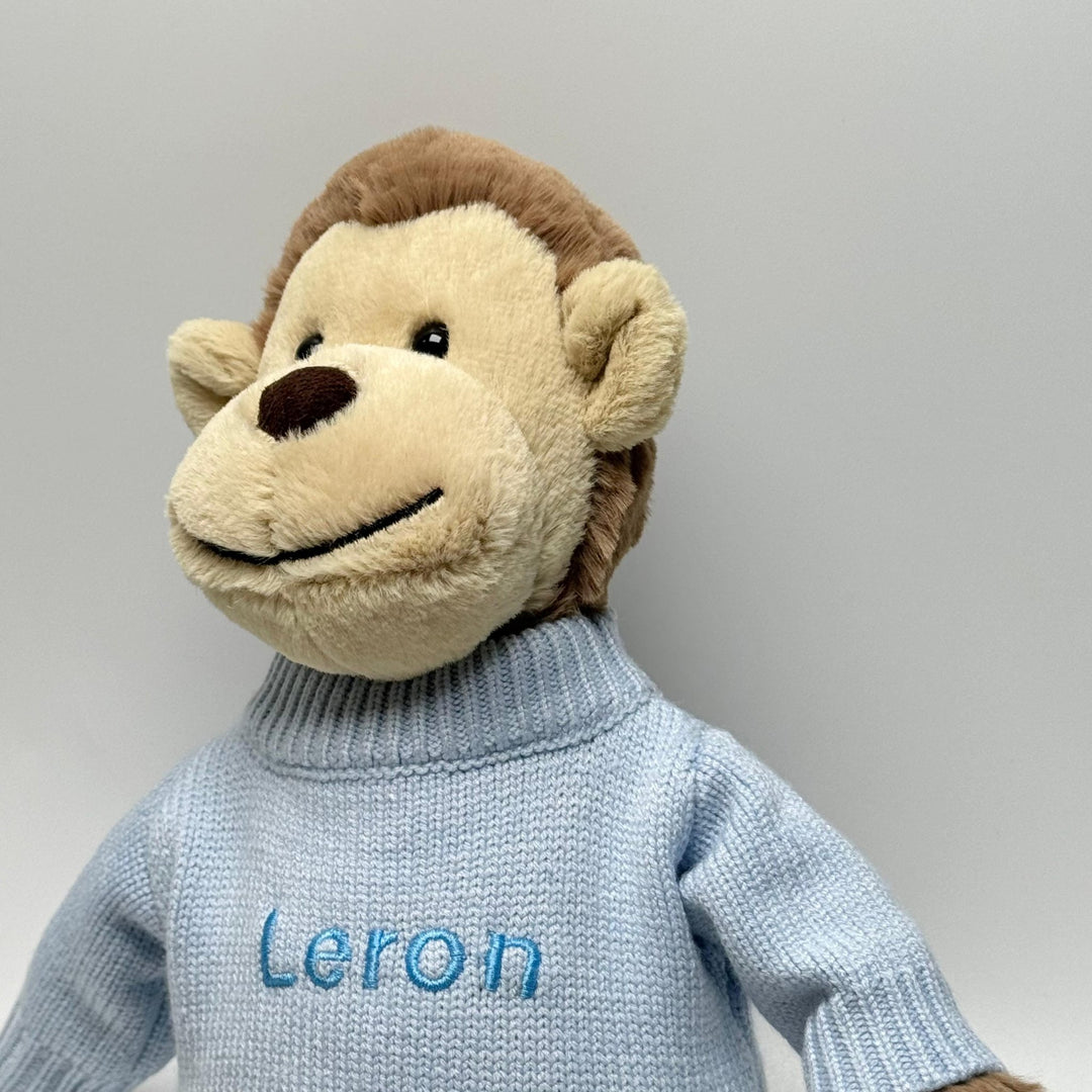 Jellycat Bashful Monkey in Blue jumper personalised with "Leron" in blue thread