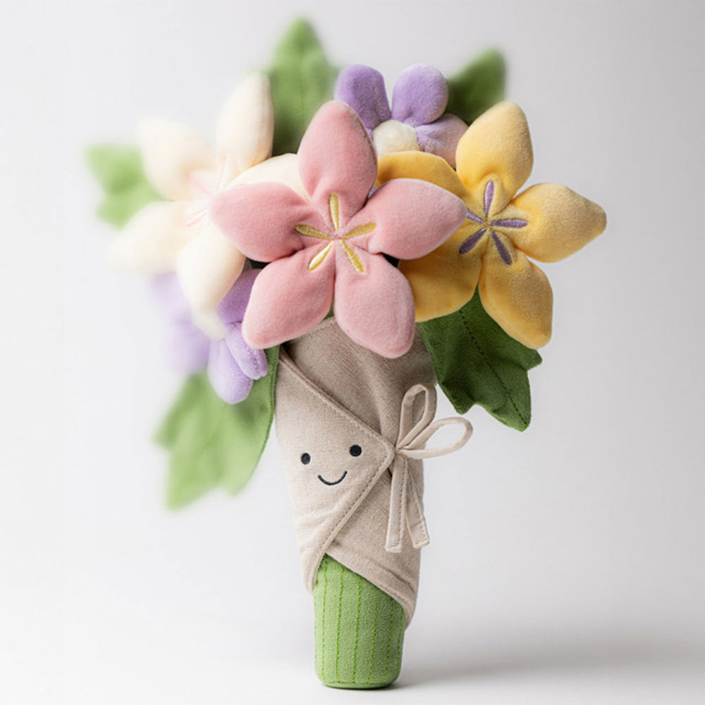 Jellycat Amuseables Bouquet of Flowers standing upright with a smiling fabric wrap, colourful plush flowers and green stem.