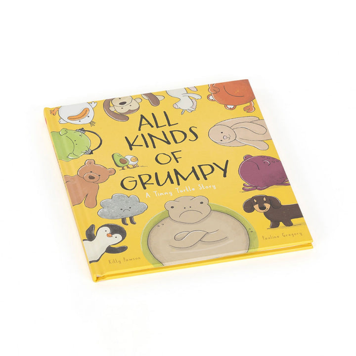 “All Kinds of Grumpy: A Timmy Turtle Story” children’s book shown at an angle, with its yellow illustrated cover featuring Timmy Turtle and a collection of animal characters.