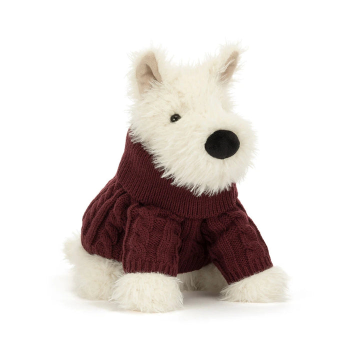 Front view of Jellycat Munro Scottie Dog plush toy wearing a burgundy knitted jumper, featuring soft cream fur, pointed ears and a black nose.
