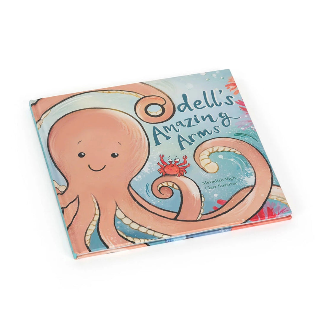 “Odell’s Amazing Arms” children’s picture book shown at an angle, featuring a smiling peach-coloured octopus on the illustrated cover.