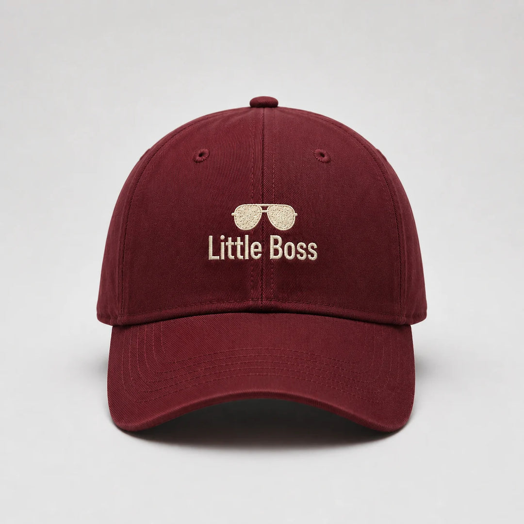 Maroon cap with 'Little Boss' text and sunglasses icon on a light gray background
