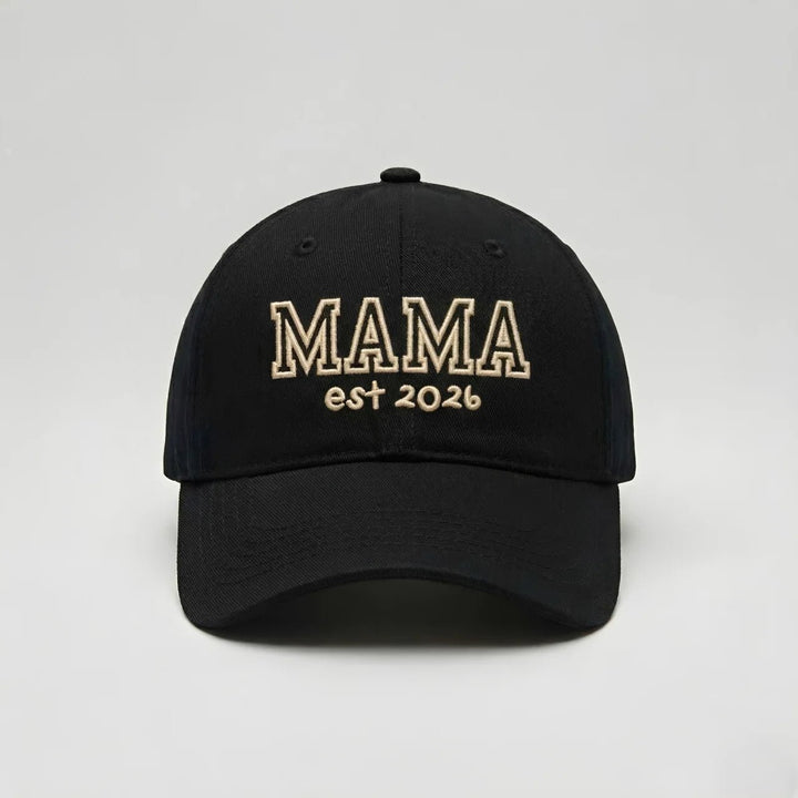Black mama cap featuring “MAMA est 2026” block outline style