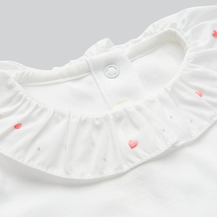 Close up of Marie Chantal's Elize Heart Embroidered Ruffle Collar Onesie
