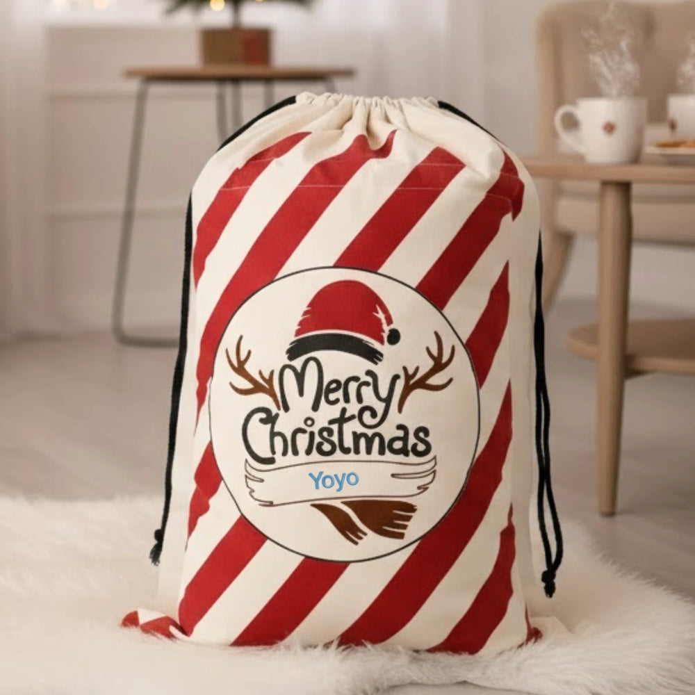 Red and white striped drawstring bag with 'Merry Christmas ' design on a light background.