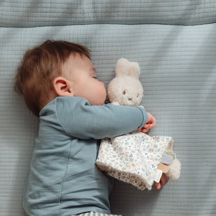 Baby hugging Miffy x Little Dutch Lucky Leaves Cuddle Cloth to sleep