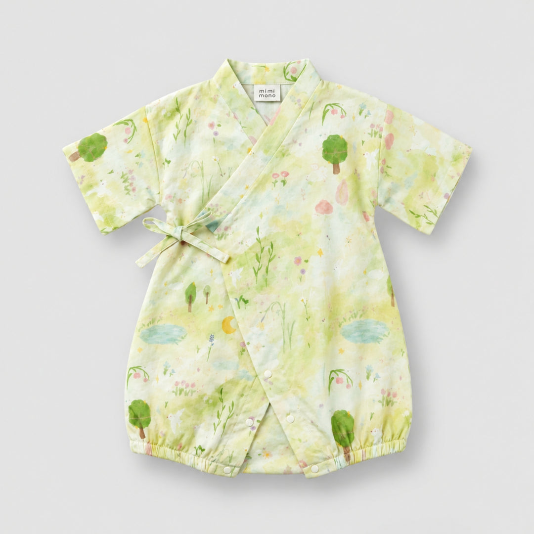 Light green kimono-style baby romper with a soft garden print featuring trees, flowers, ponds and nature illustrations.