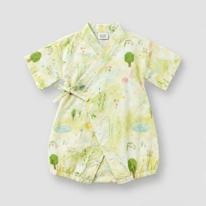 Light green kimono-style baby romper with a soft garden print featuring trees, flowers, ponds and nature illustrations.
