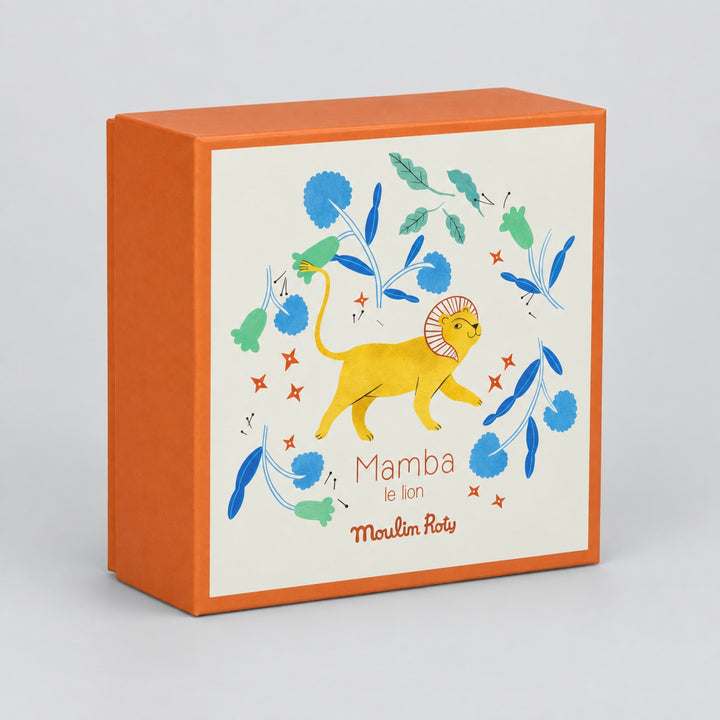 Moulin Roty Mamba the Lion gift box with colourful illustrated lion and floral design on a light grey studio background.