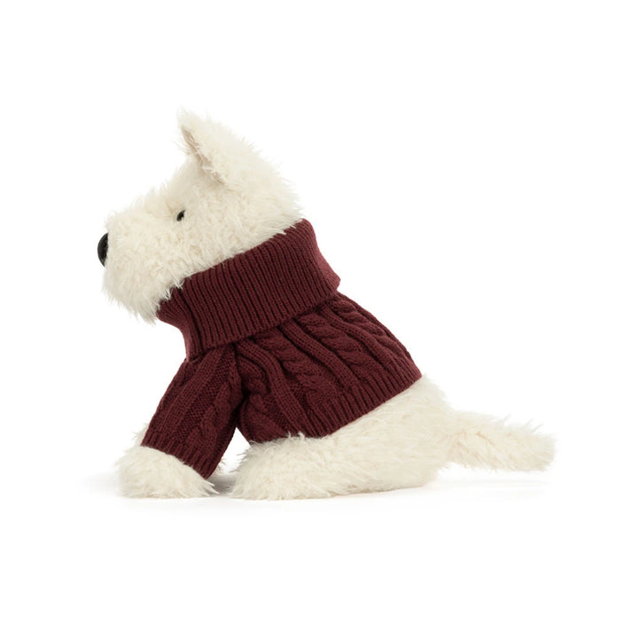 Side view of Jellycat Munro Scottie Dog plush toy with fluffy cream fur, wearing a burgundy cable-knit turtleneck jumper.