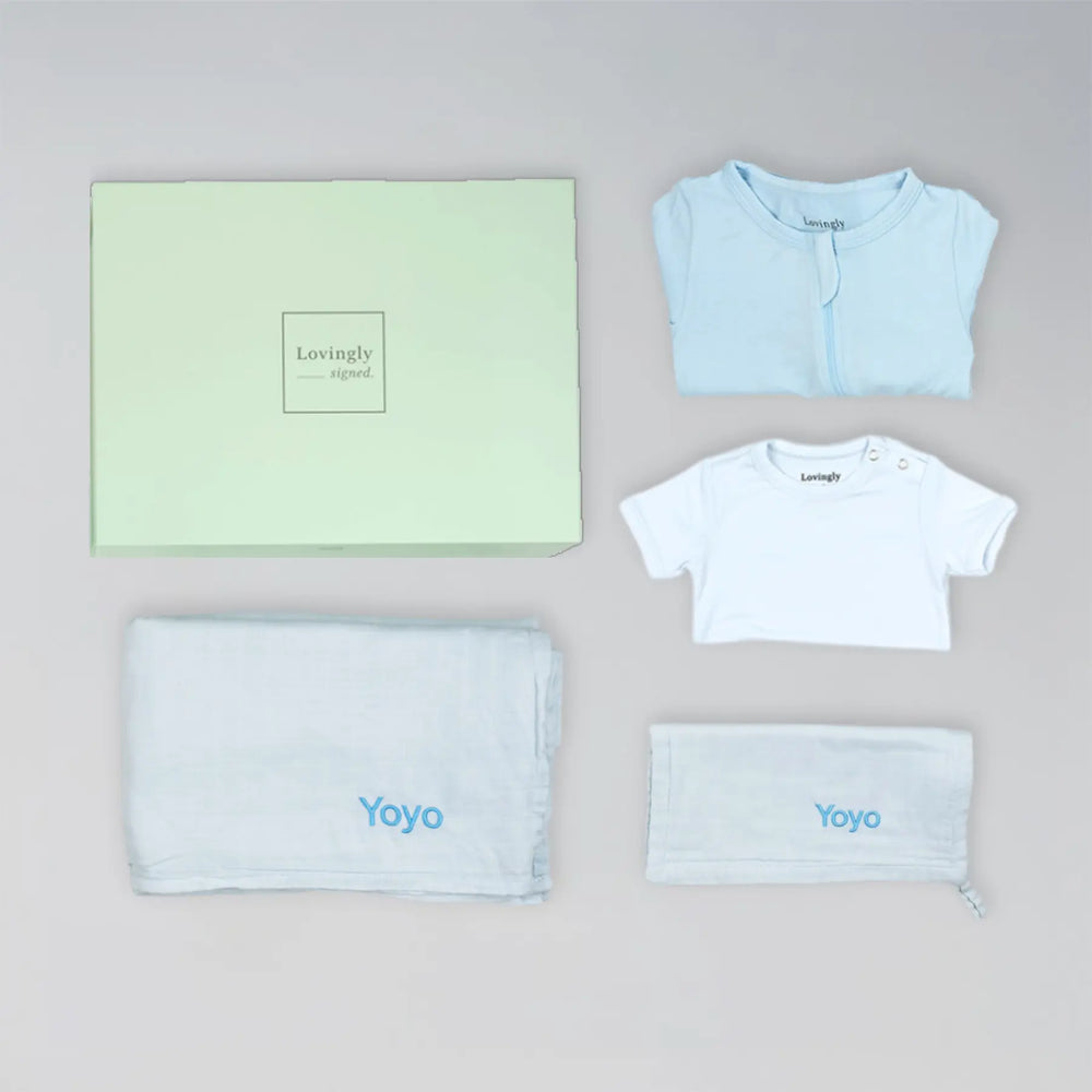 Soft blue bamboo gift set for newborns with swaddle, wash cloth, babygrow and bodysuit