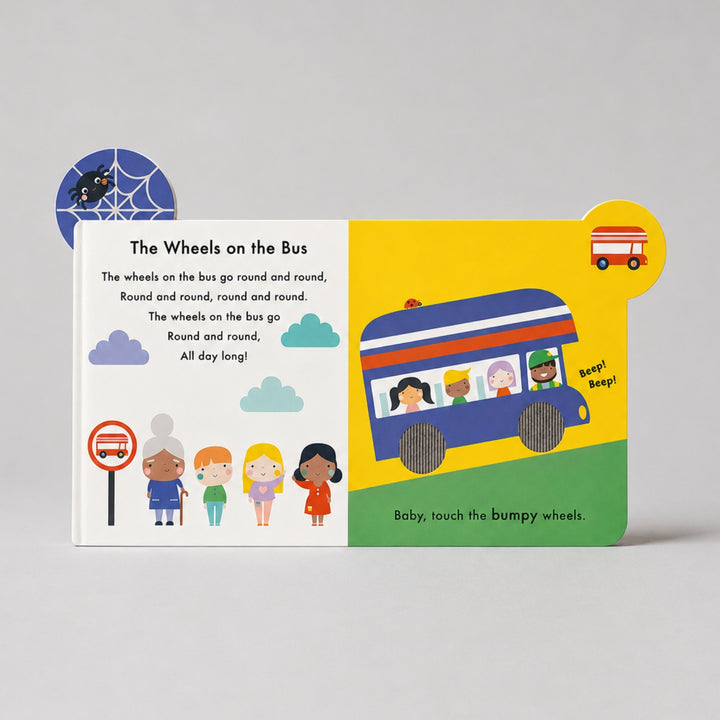 Baby Touch Nursery Rhymes book open to “The Wheels on the Bus”, featuring colourful illustrations, touch-and-feel wheels and interactive tabs.