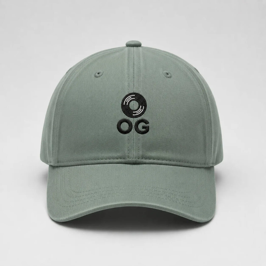 Green cap with black logo on a light gray background