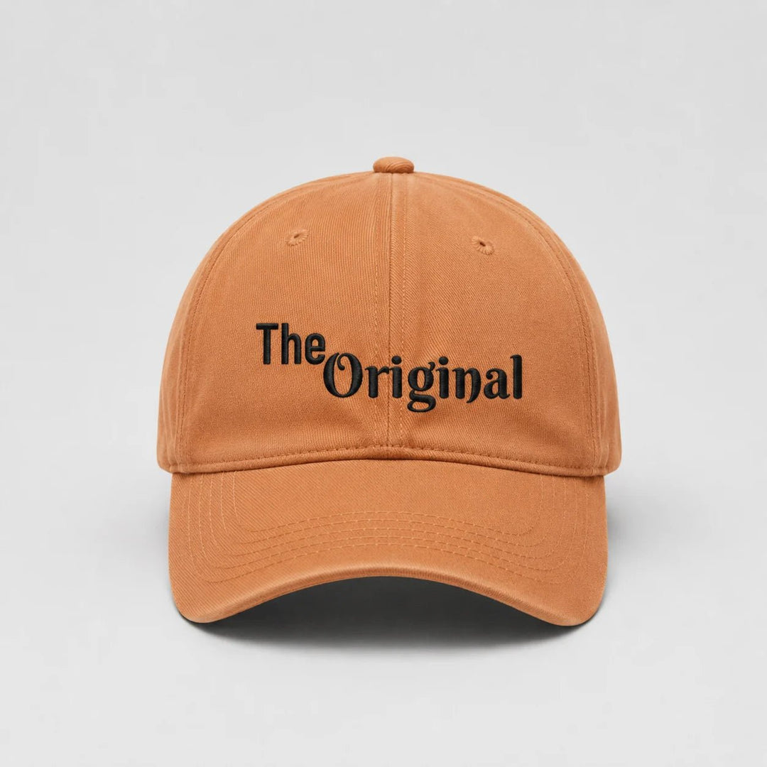 Brown cap with 'The Original' text on a light gray background