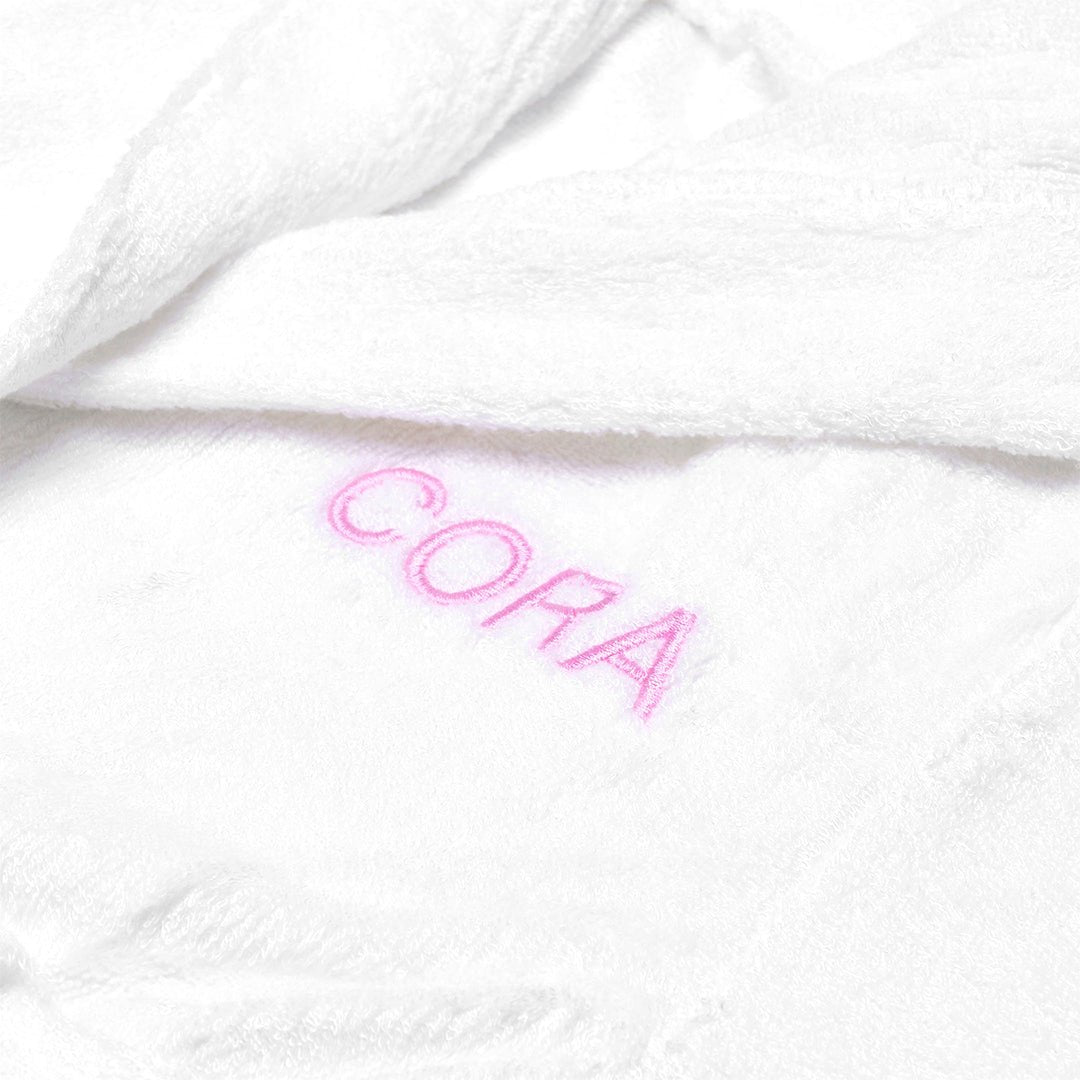 White Bamboo Robe personalised with "CORA" in pink thread