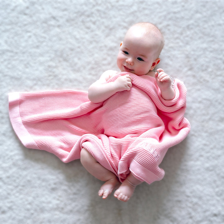 Baby using Pink Bamboo Blanket