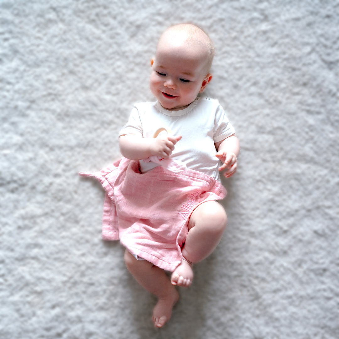 Baby with Pink Burp Cloth