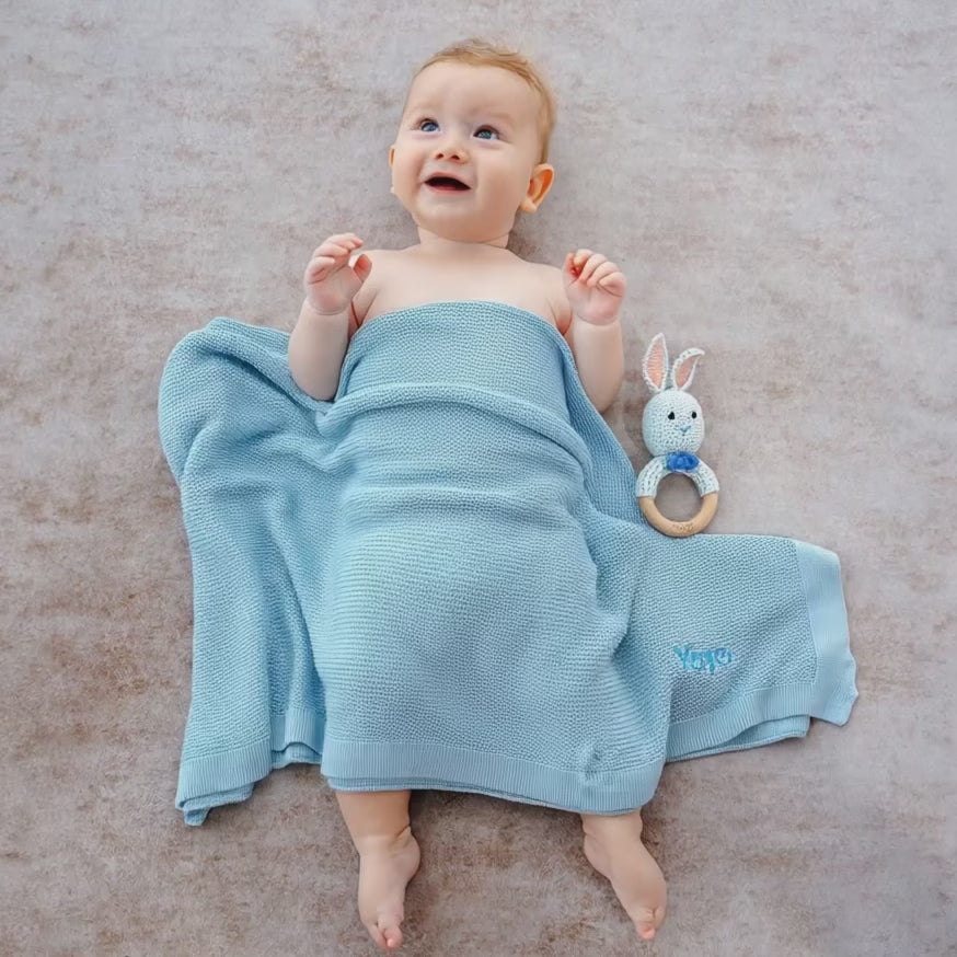 Baby covered in Personalised Blue Bamboo Cellular Blanket