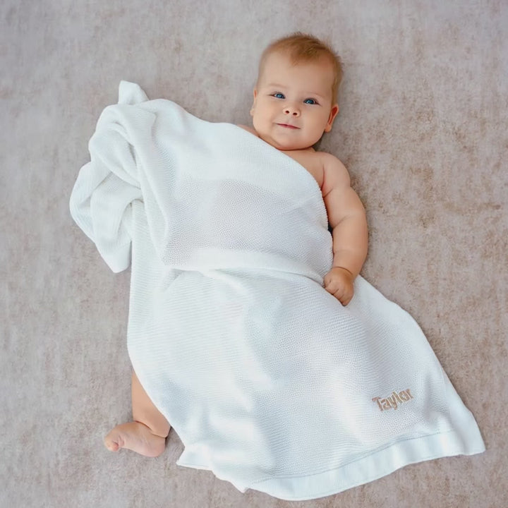 Baby covered in Personalised White Bamboo Cellular Blanket