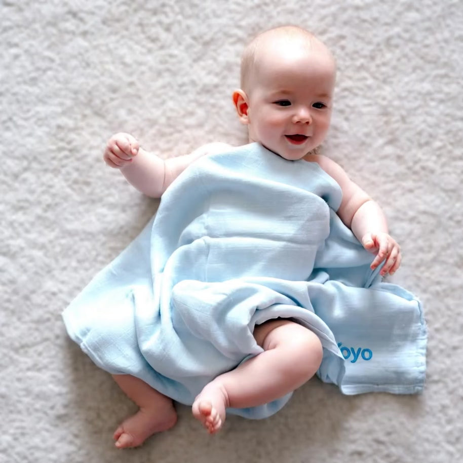 Baby covering with the personalised blue bamboo swaddle