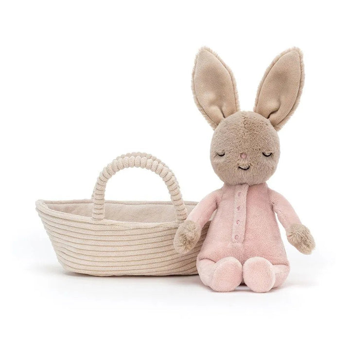 Jellycat Rock-a-Bye Bunny in a soft pink onesie, dreaming of lettuce, ready for a gentle, cozy snuggle.