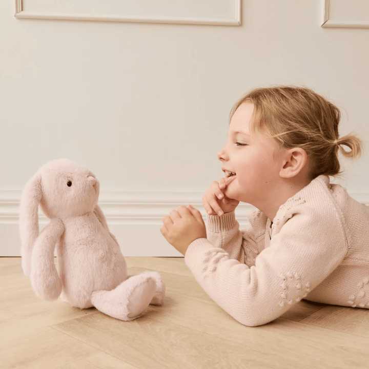 Girl playing with Snuggle Bunnies Penelope - Blossom