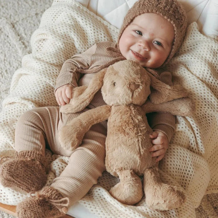 Baby hugging Snuggle Bunnies Penelope Bunny - Caramel 