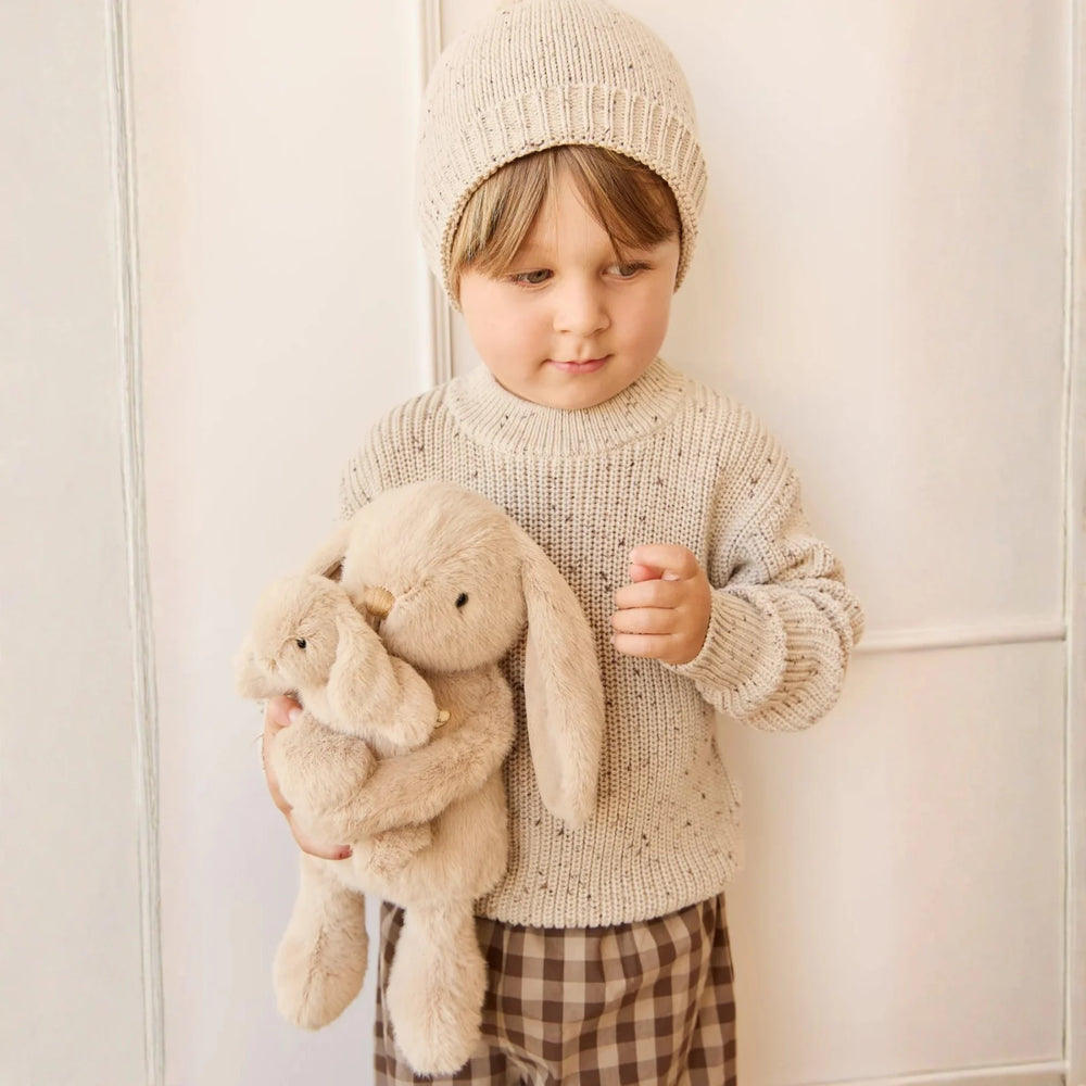 Boy hugging his Snuggle Bunnies Frankie the Hugging Bunny - Caramel