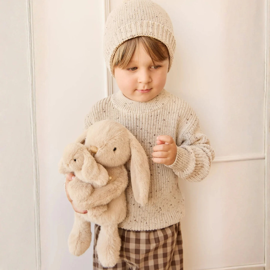 Boy hugging his Snuggle Bunnies Frankie the Hugging Bunny - Caramel