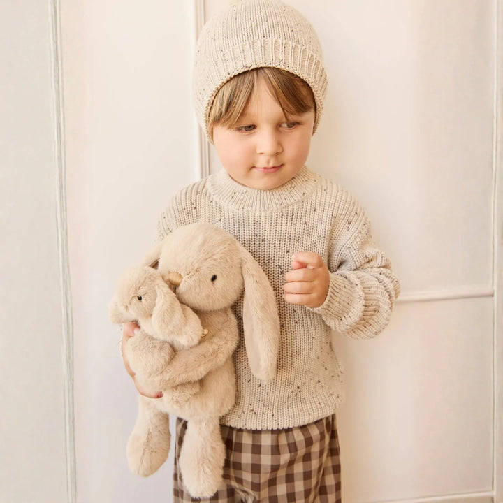Boy hugging his Snuggle Bunnies Frankie the Hugging Bunny - Caramel