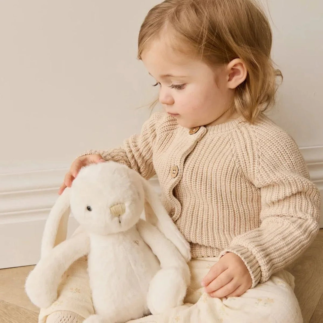 Child playing with Snuggle Bunnies Penelope - Marshmallow