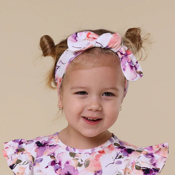 Soft pink floral baby headband in GOTS-certified cotton